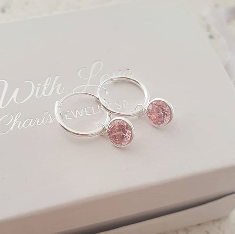 silver hoop earrings with pink dangle stone