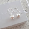Silver pearl dangle earrings